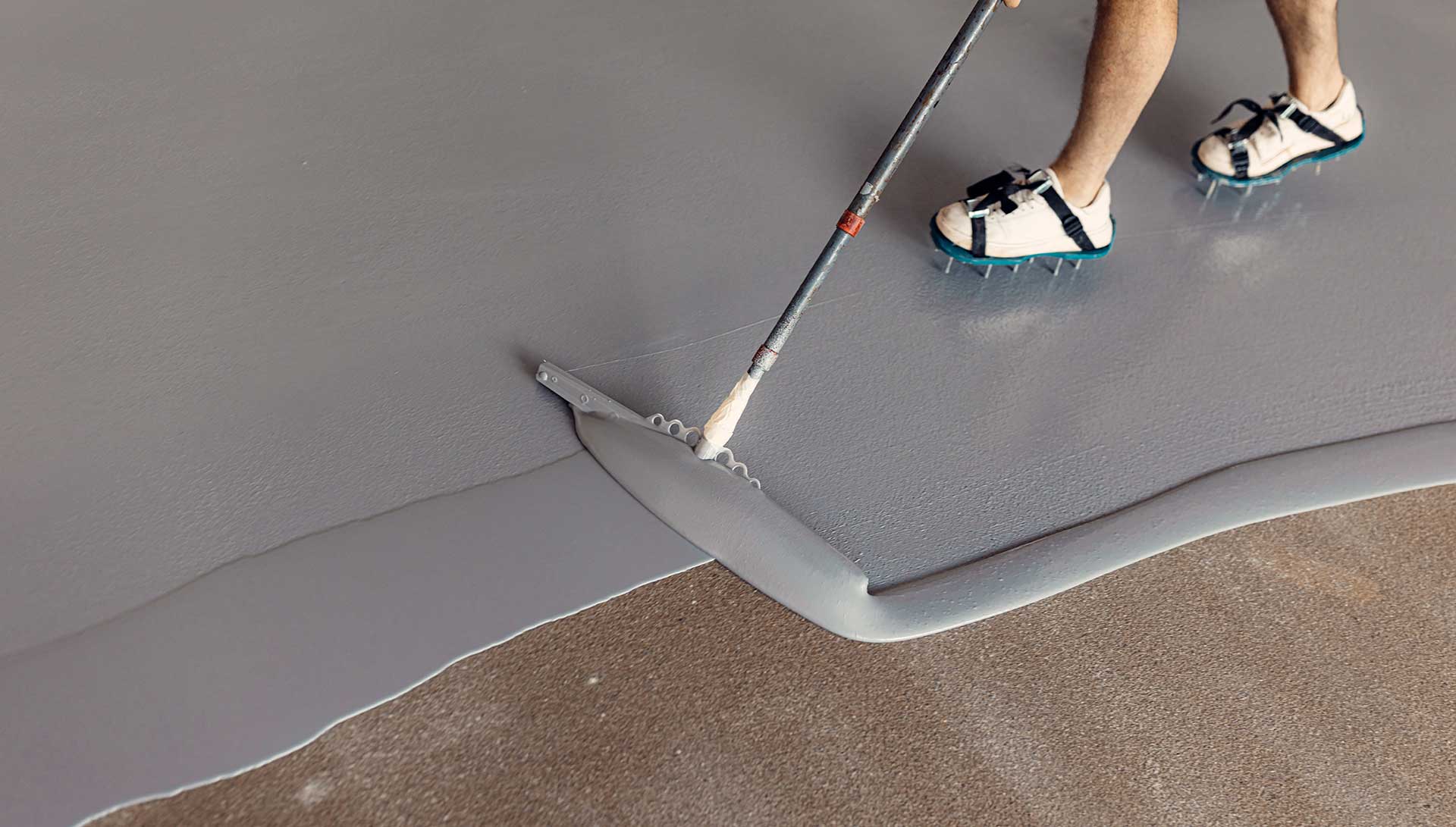 Professional epoxy floor application in progress for commercial and industrial use by CEMX FLOOR